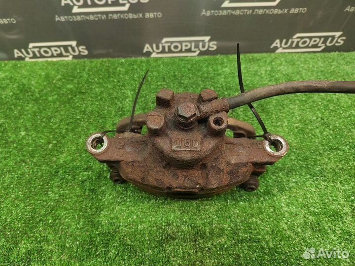 Суппорт передний левый Mitsubishi Lancer X седан