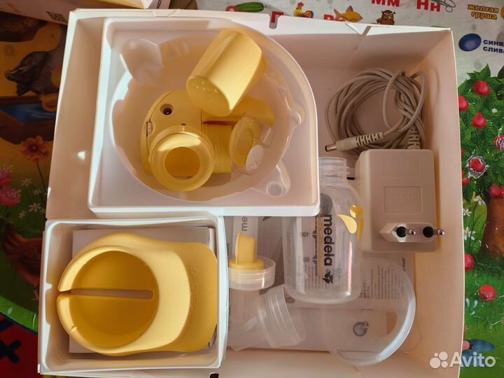 Молокоотсос medela электрический