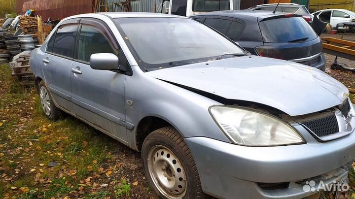 Кулак поворотный передний левый Mitsubishi Lancer9