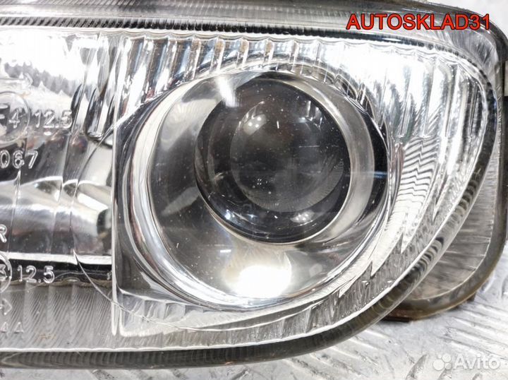 Фара левая Mazda 323 BA 2161128L