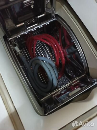 Стиральная машина Ariston с вертикальной загрузкой