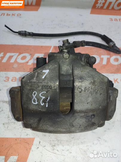 Суппорт тормозной передний левый Skoda Rapid рест