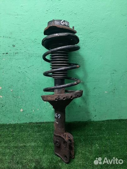 Стойка амортизатора передняя левая Subaru Foreste