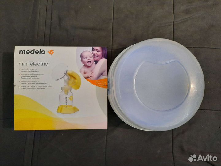 Молокоотсос medela электрический