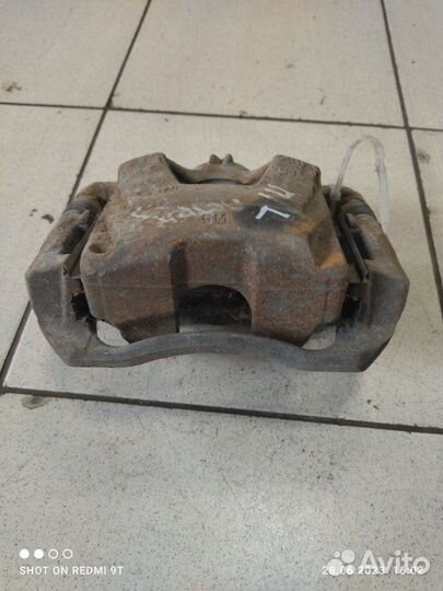 Суппорт тормозной передний левый Opel Astra J