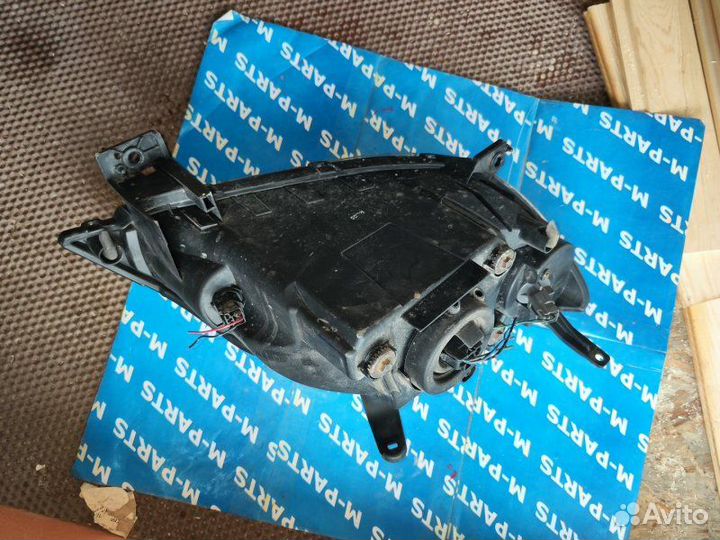 Фара передняя левая Mazda Demio DY3W