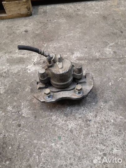 Суппорт тормозной передний левый Mazda 3 BL рест