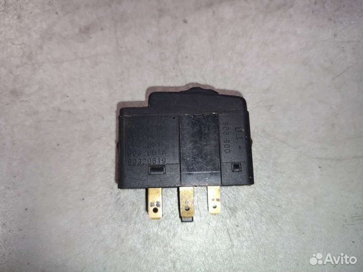 Кнопка корректора фар на Opel Astra F