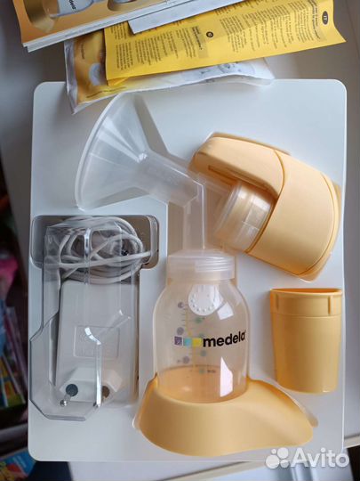 Молокоотсос medela электрический