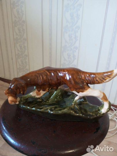 Собака с уткой