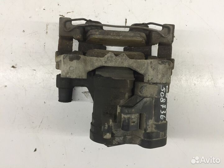 Суппорт задний левый (Volkswagen Passat)