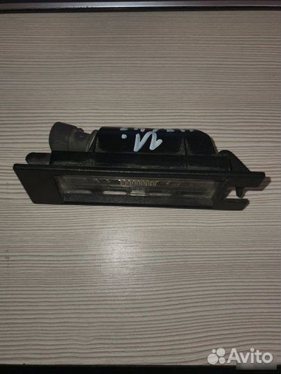 Фонарь подсветки номера задний Opel Astra H