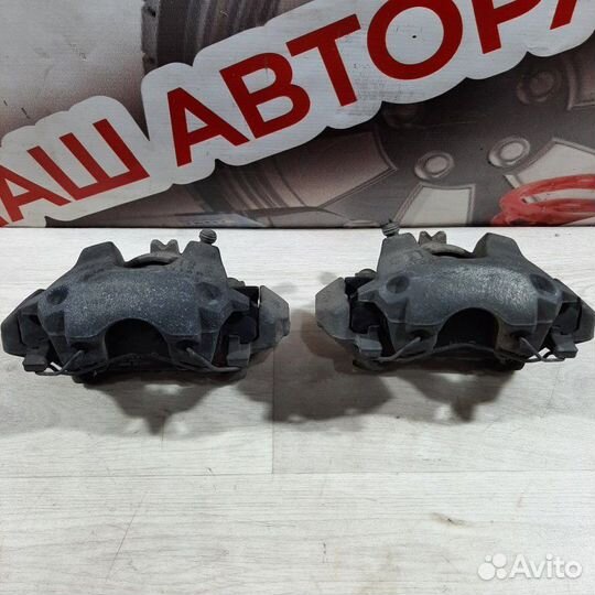 Суппорт тормозной передний Renault Logan седан