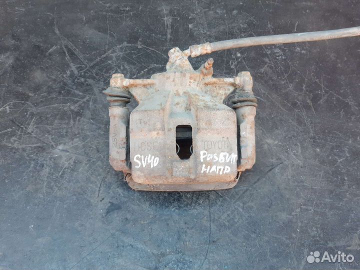 Суппорт левый Toyota Vista/Camry SV40