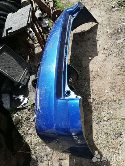 Бампер задний Мазда Демио 1