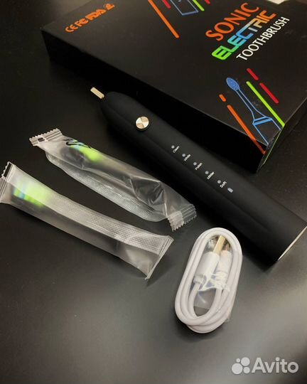 Электрическая зубная щетка