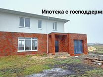 Комбинированный дом из кирпича и штукатурки короед