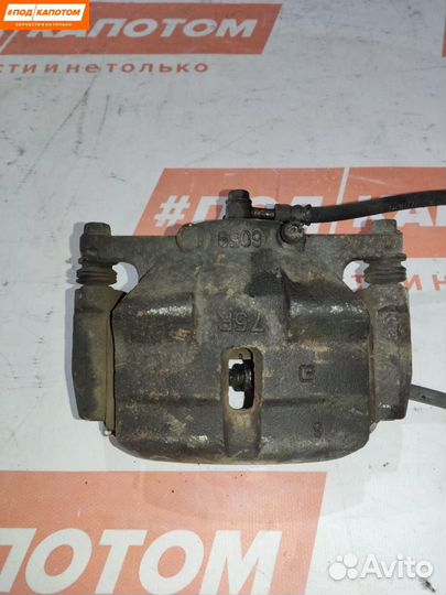 Суппорт тормозной передний левый Nissan X-Trail