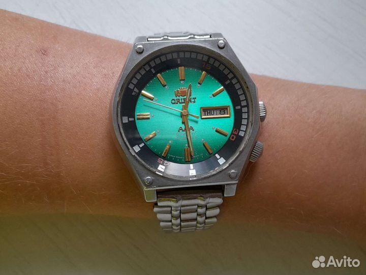 Золотые часы orient с серебряным ремешком