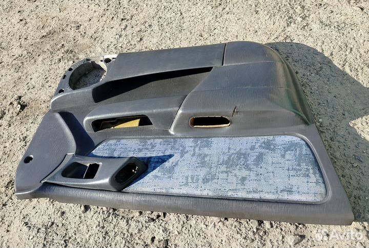 Обшивка передней левой двери Toyota Carina E