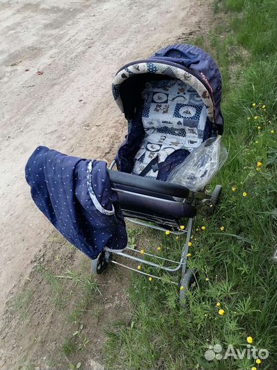 Детская прогулочная коляска с перекидной ручкой