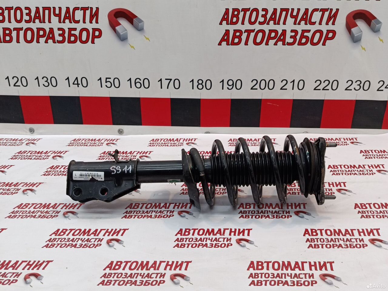 Стойка передняя левая Джили Эмгранд SS11