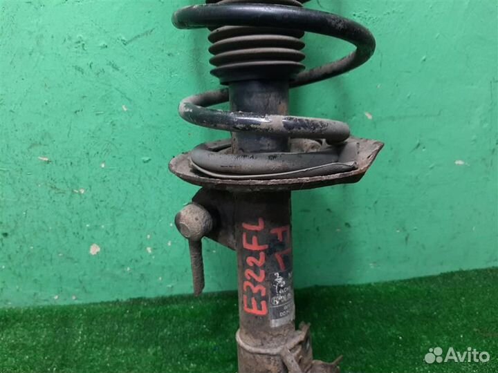 Стойка амортизатора передняя левая Nissan Qashqai