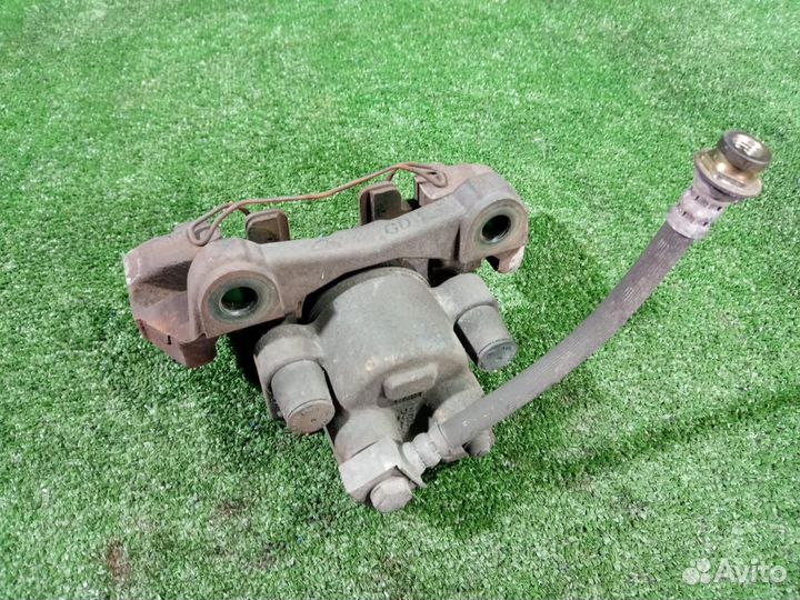 Суппорт тормозной задний левый Jeep Grand Cherokee