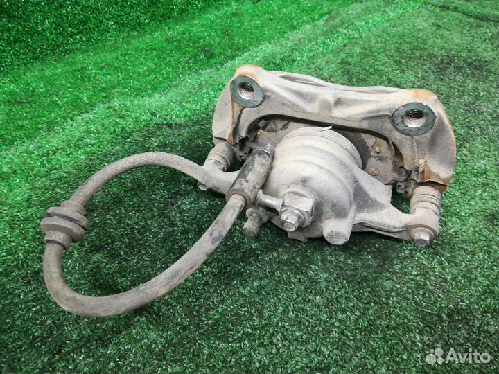 Суппорт тормозной передний правый Chevrolet Tracke