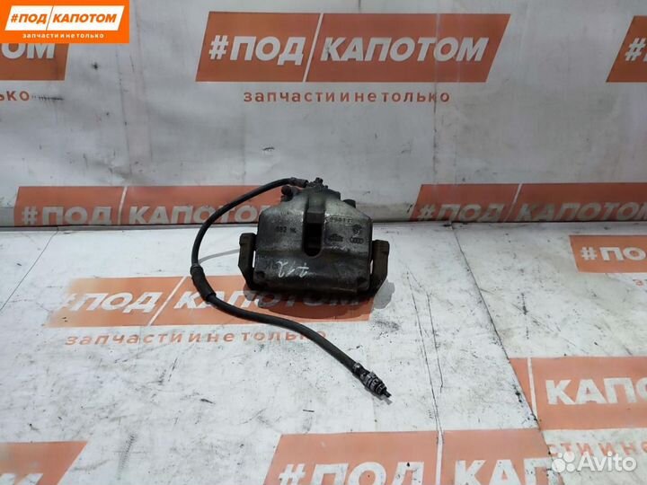 Суппорт тормозной передний левый Volkswagen Passat