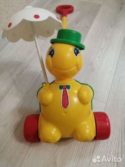 Игрушка каталка с ручкой