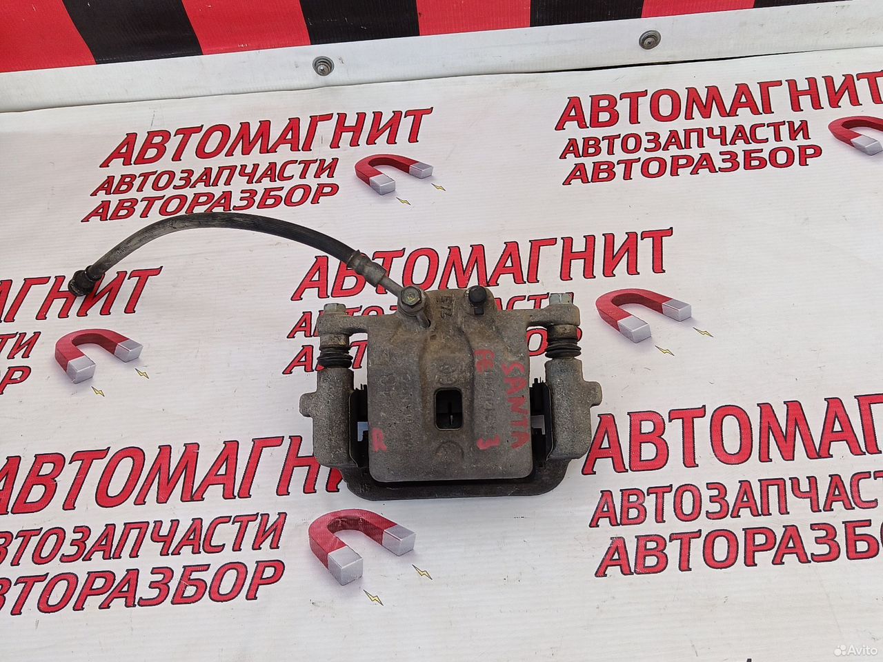 Суппорт тормозной задний Хендай Санта Фе 3 DM