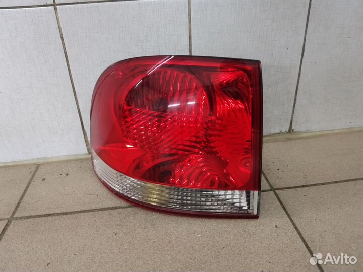 Фонарь левый наружный оригинал VW Touareg 1 7L