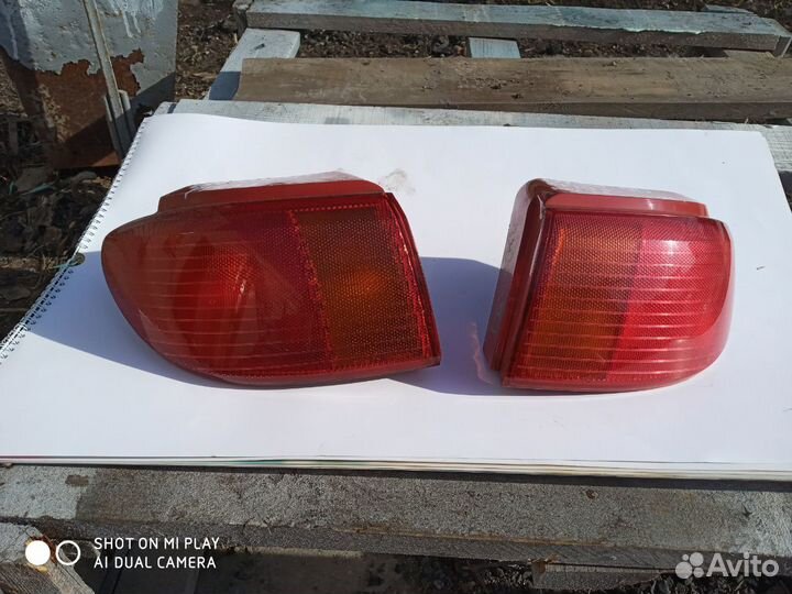 Стоп сигнал Мазда Демио. Фонарь Mazda Demio