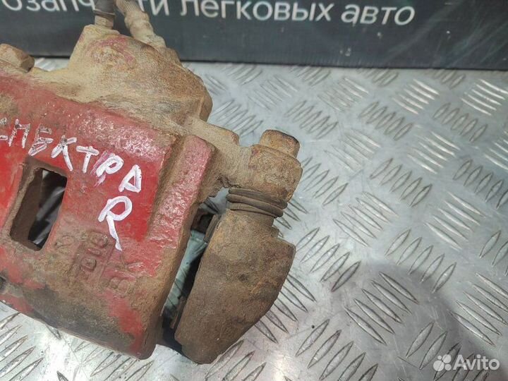 Суппорт тормозной передний правый Kia Spectra