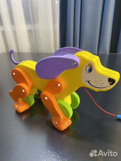 Игрушка собачка каталка