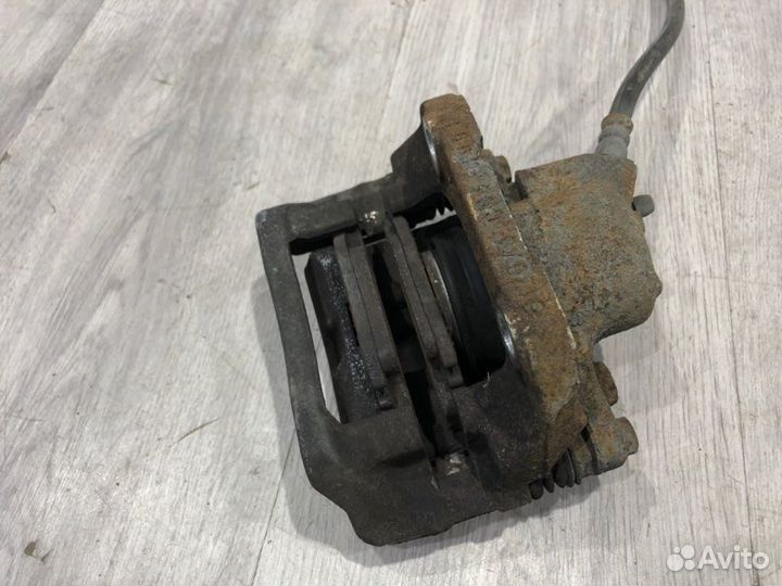 Суппорт тормозной передний левый Renault Logan