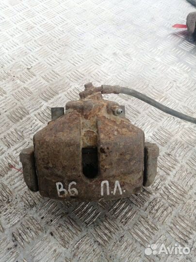 Суппорт передний левый Volkswagen Passat B6 3C2