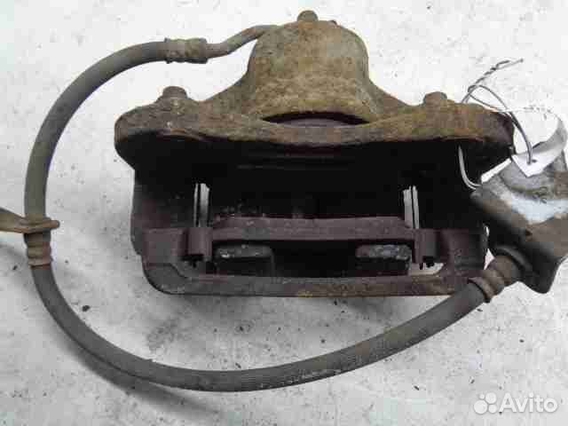 Суппорт передний левый Hyundai Tucson 2 LM