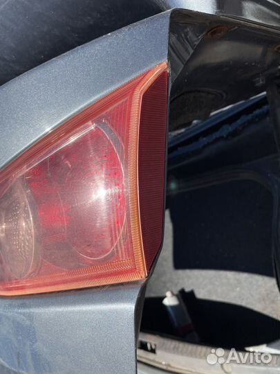 Mitsubishi lancer 10 фонарь в крышку багажника