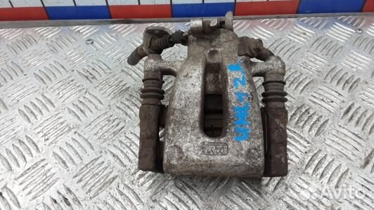 Суппорт тормозной задний правый opel zafira B (UML