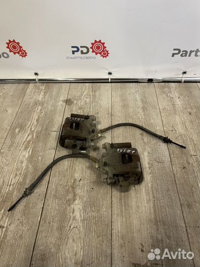 Суппорт передний левый правый Nissan Teana J32