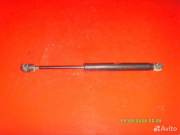 Амортизатор крышки багажника Mitsubishi Lancer 10