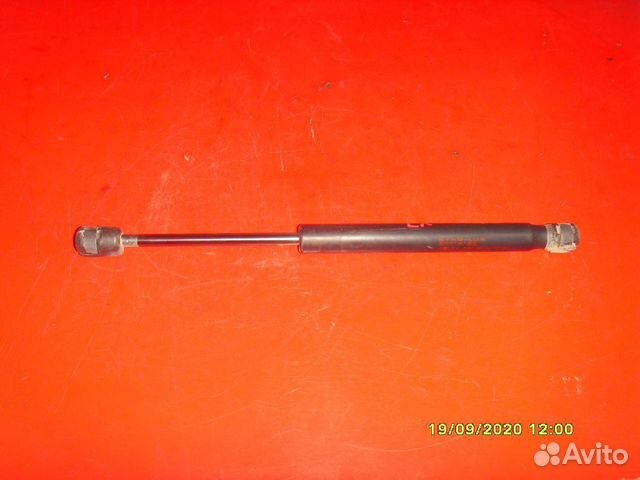 Амортизатор крышки багажника Mitsubishi Lancer 10