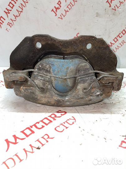 Суппорт тормозной передний левый Mazda 3 BL седан