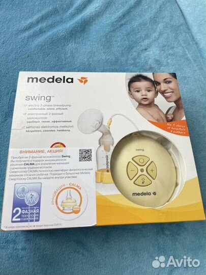 Молокоотсос medela swing